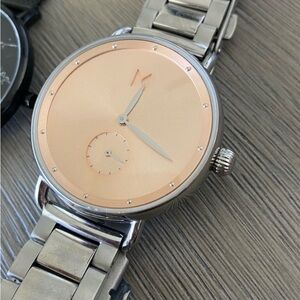 Women’s MVMT watch. Silver and pink face. Needs battery